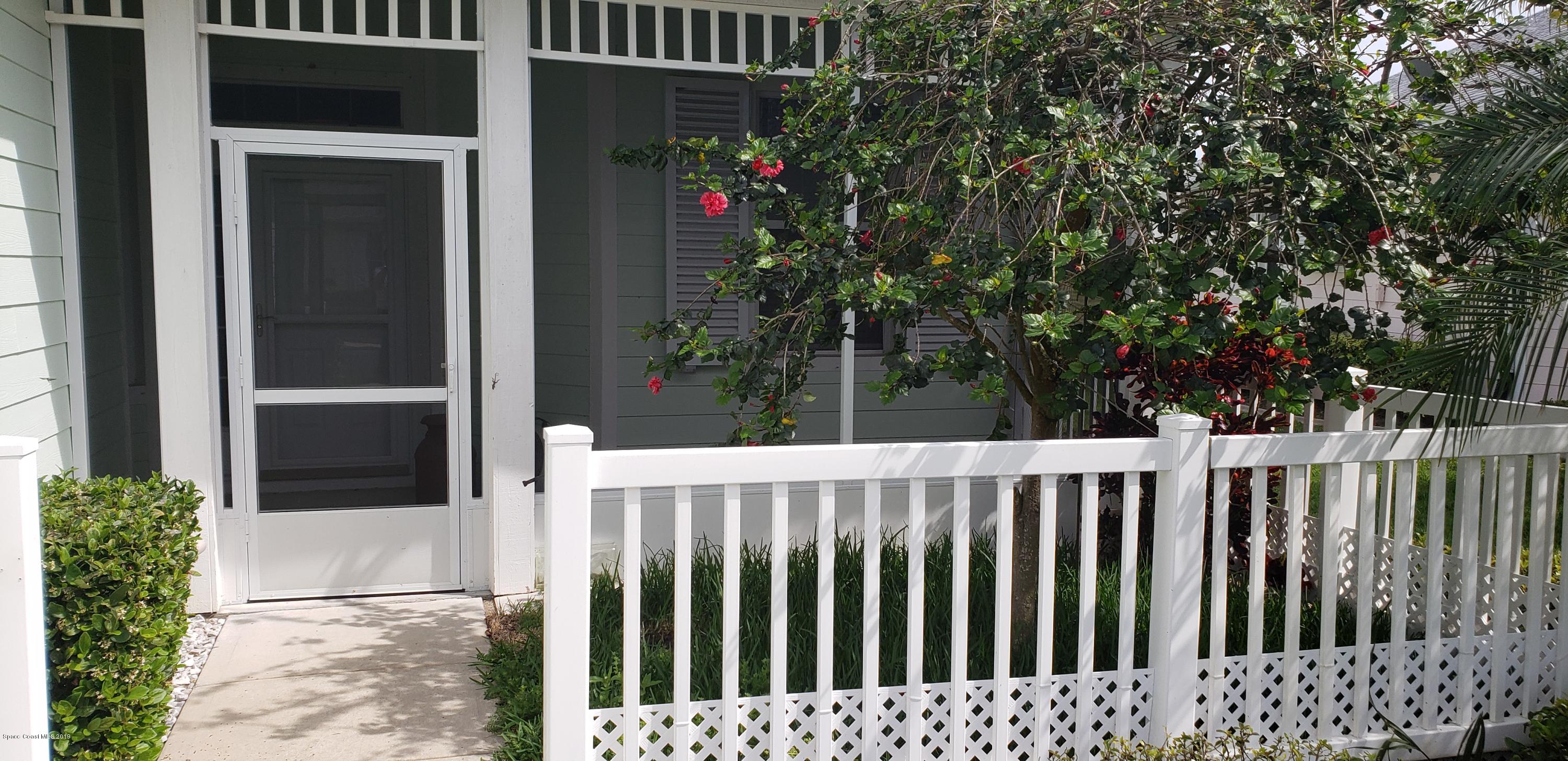 1050 Eleuthera Drive Northeast Palm Bay, FL 32905 - Photo 2 of 12 FRONT COURTYARD AND SCREEN PORCH