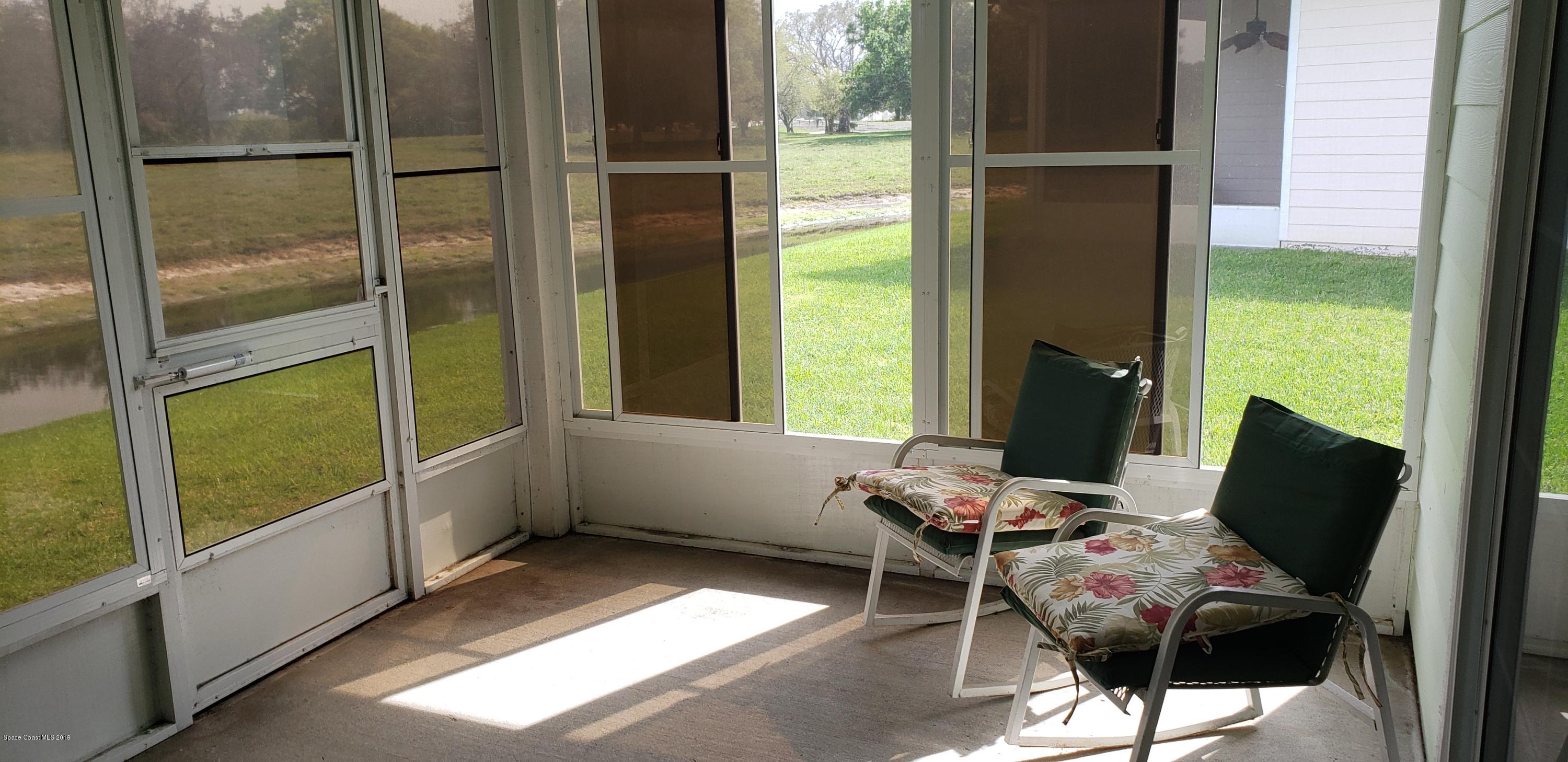 1050 Eleuthera Drive Northeast Palm Bay, FL 32905 - Photo 3 of 12 REAR SCREENED PORCH/FLORIDA ROOM