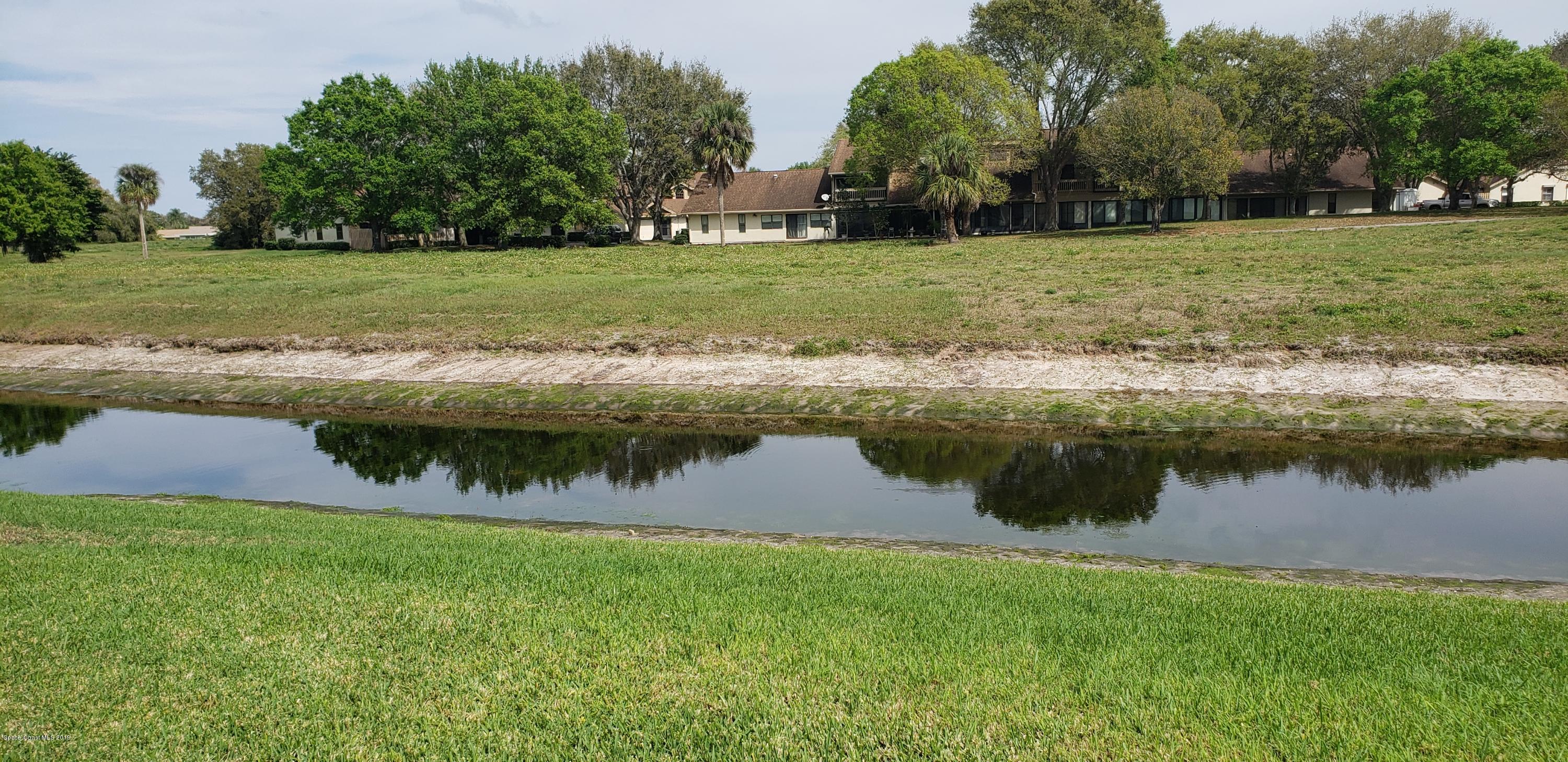 1050 Eleuthera Drive Northeast Palm Bay, FL 32905 - Photo 4 of 12 REAR LAKE/CANAL