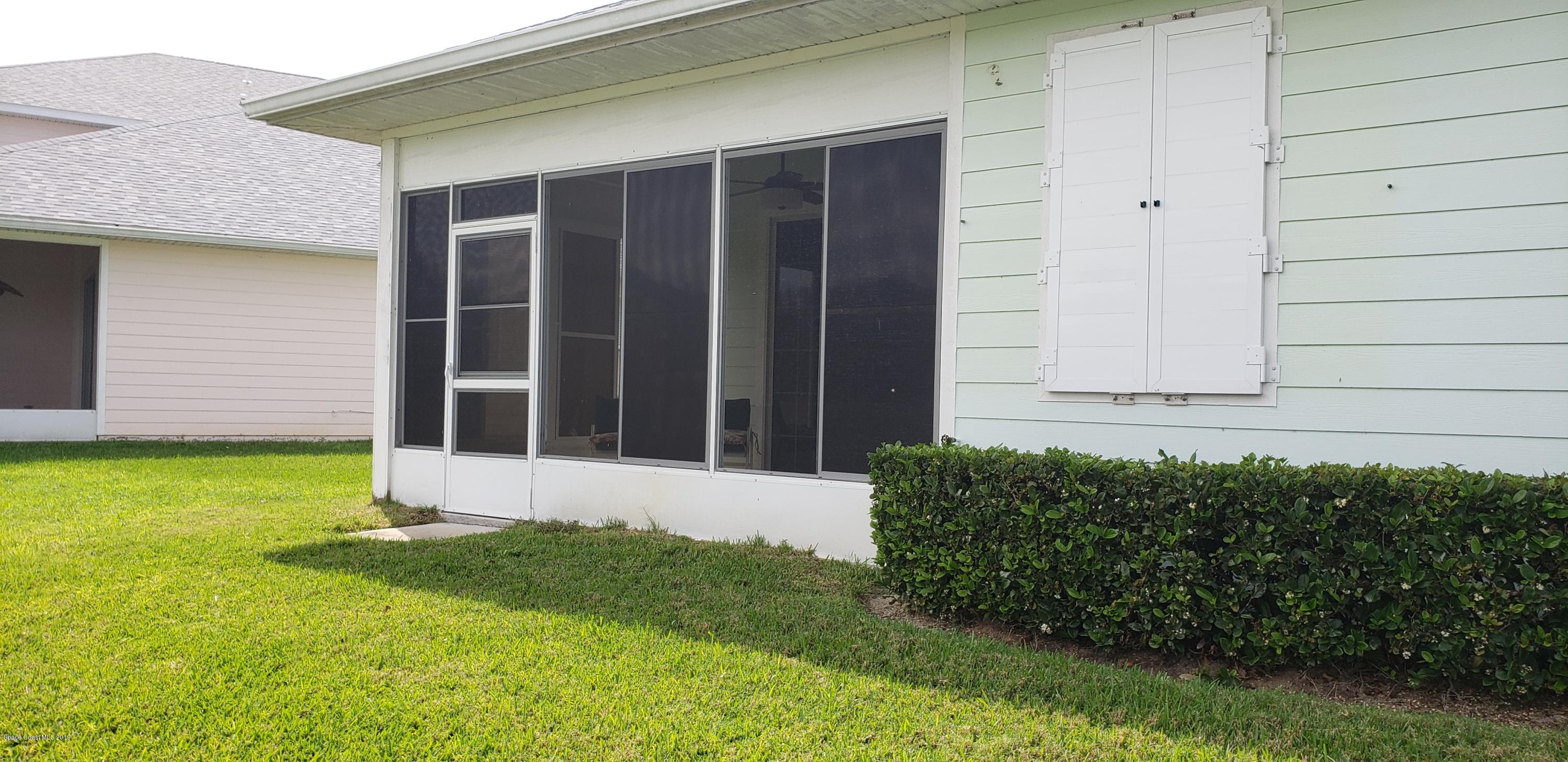 1050 Eleuthera Drive Northeast Palm Bay, FL 32905 - Photo 5 of 12 REAR OF HOME