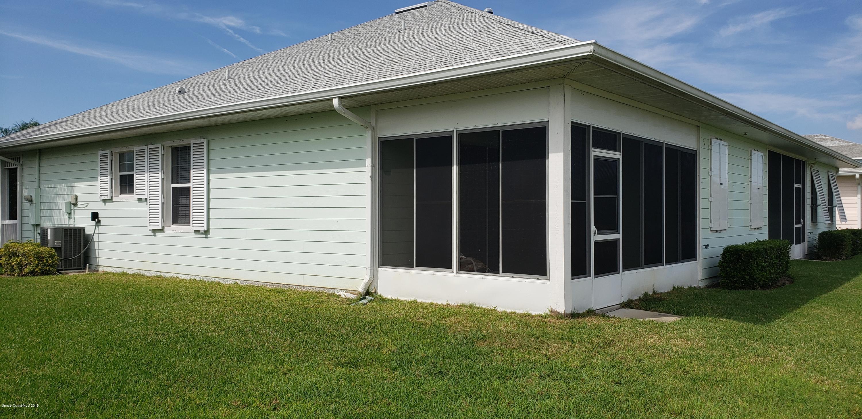 1050 Eleuthera Drive Northeast Palm Bay, FL 32905 - Photo 6 of 12 REAR OF HOME