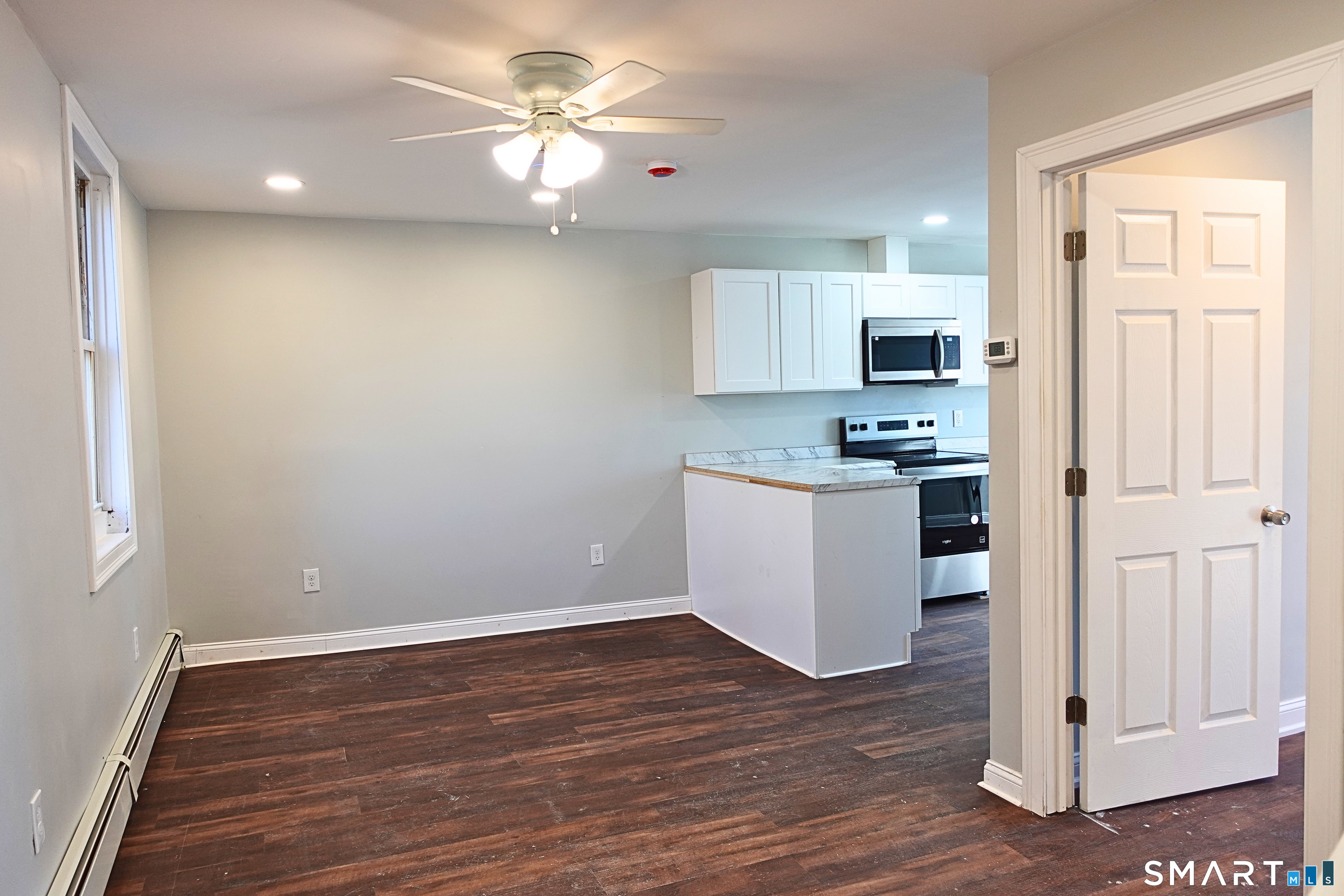 88 Taftville-Occum Road, Unit C Norwich, CT 06360 - Photo 2 of 28 a view of kitchen with sink and wooden floor