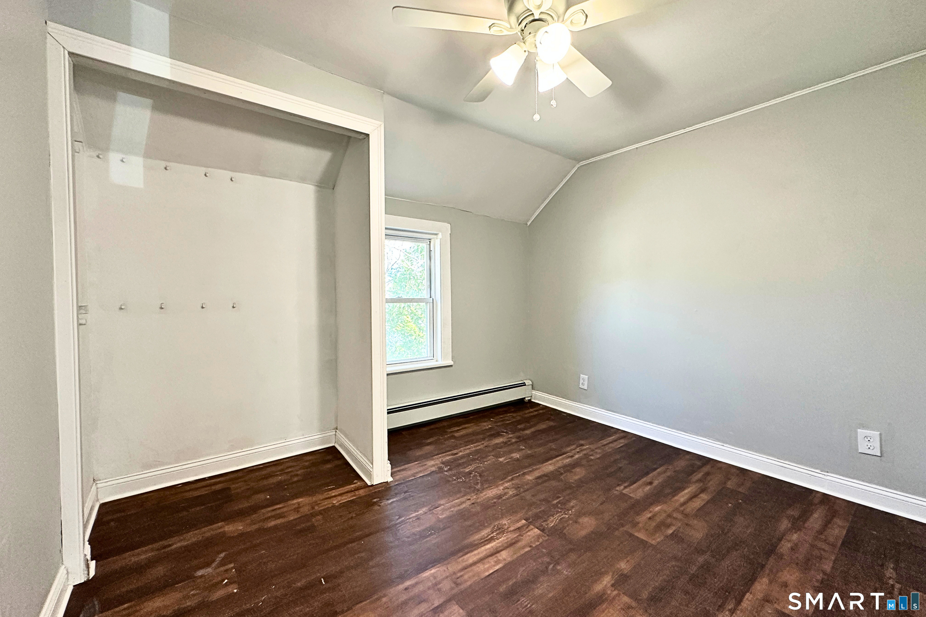 88 Taftville-Occum Road, Unit C Norwich, CT 06360 - Photo 21 of 28 an empty room with wooden floor and windows