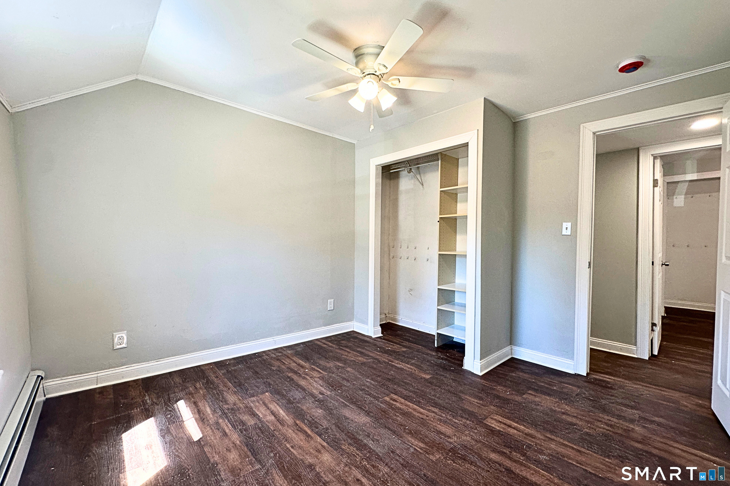 88 Taftville-Occum Road, Unit C Norwich, CT 06360 - Photo 23 of 28 an empty room with wooden floor and entryway