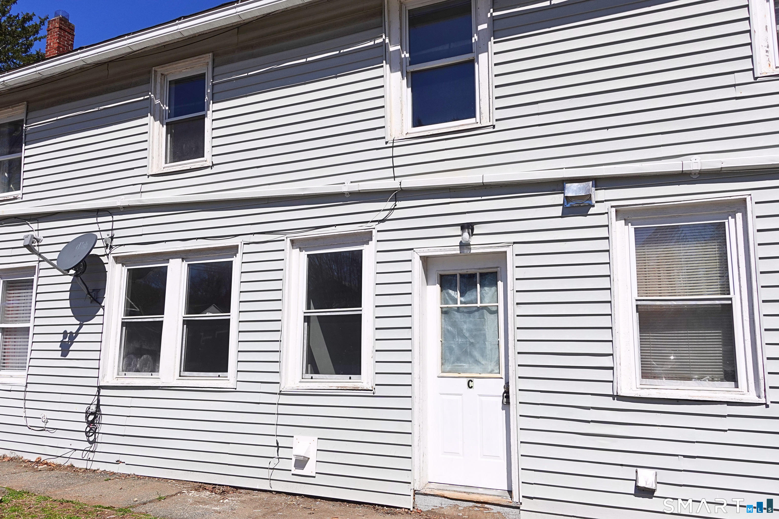 88 Taftville-Occum Road, Unit C Norwich, CT 06360 - Photo 25 of 28 a view of a house with a white house