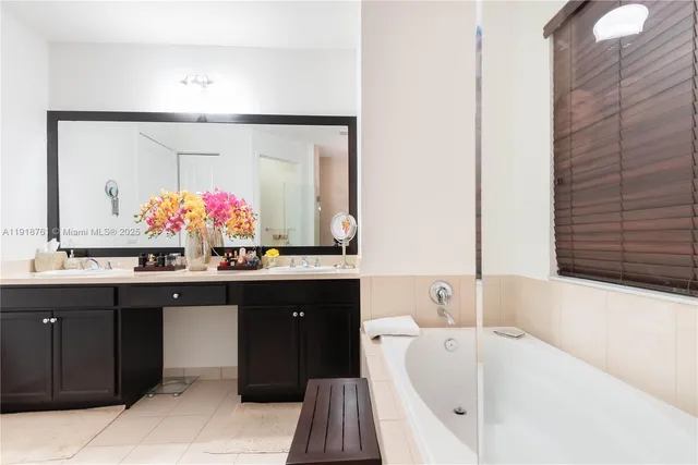 a bathroom with a bathtub and a sink