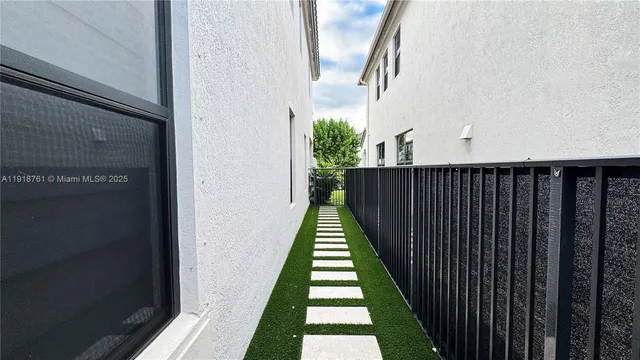 a view of balcony with wooden floor