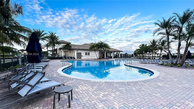 a view of a swimming pool with a patio