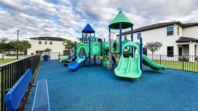 a childrens park with lots of swings and slides