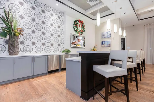a view of a dining room with furniture and a potted plant