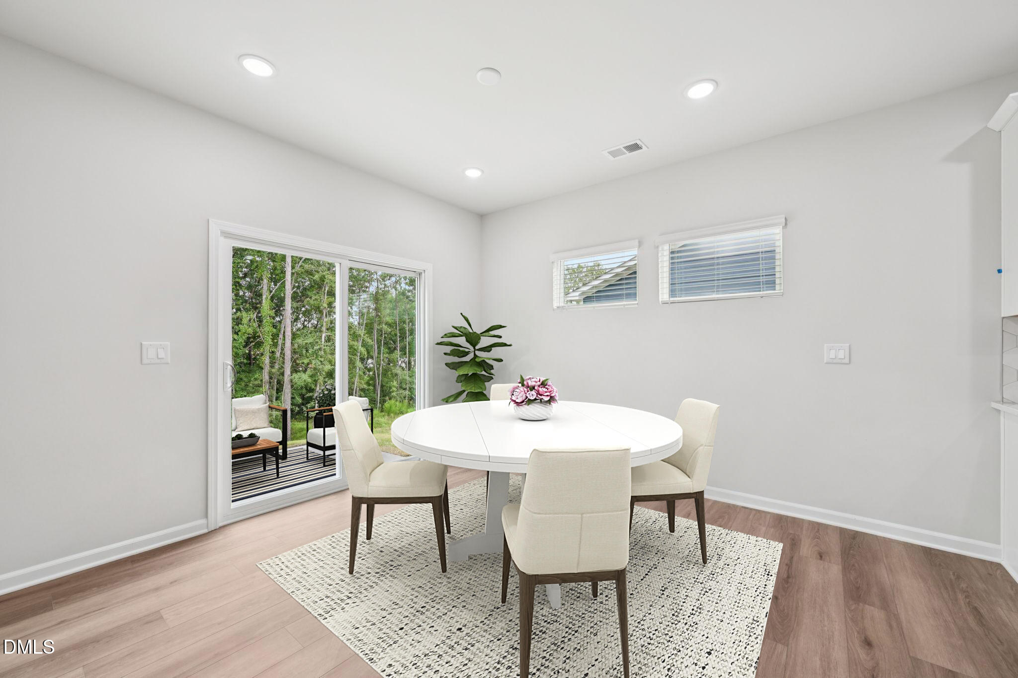 1454 Hatteras Road Durham, NC 27703 - Photo 14 of 53 a view of a dining room with furniture window and wooden floor