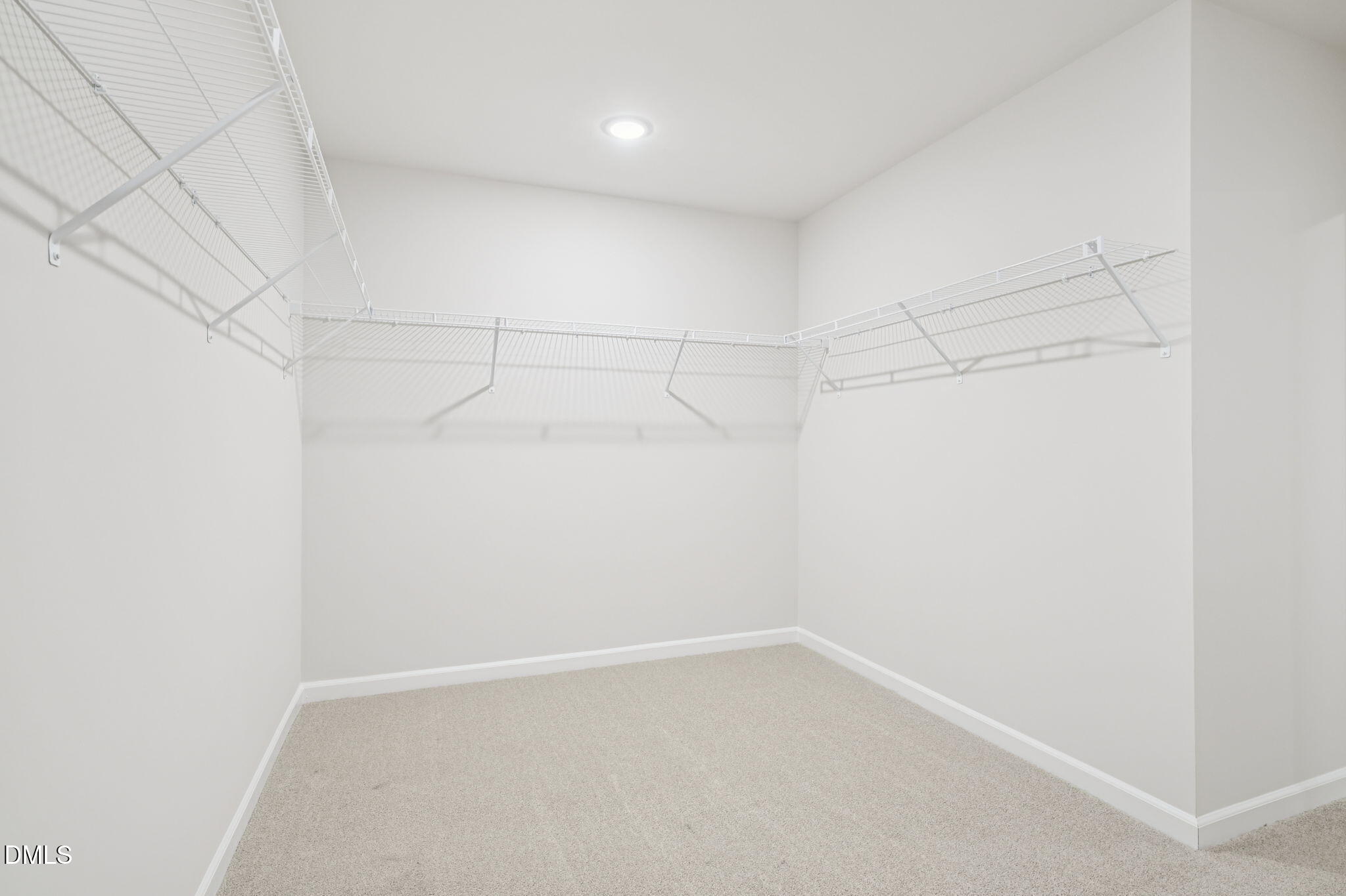1454 Hatteras Road Durham, NC 27703 - Photo 42 of 53 a view of a room with racks on the wall