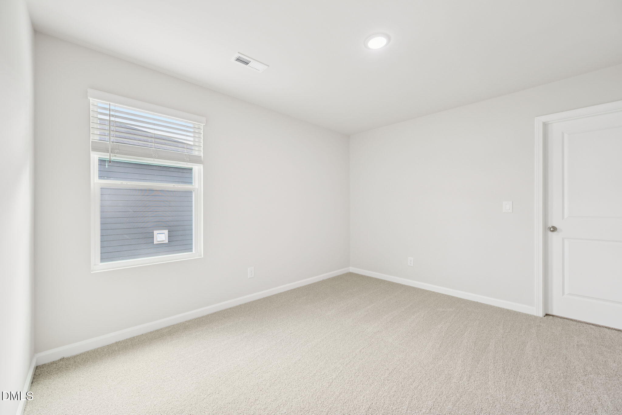 1454 Hatteras Road Durham, NC 27703 - Photo 50 of 53 a view of an empty room with a window