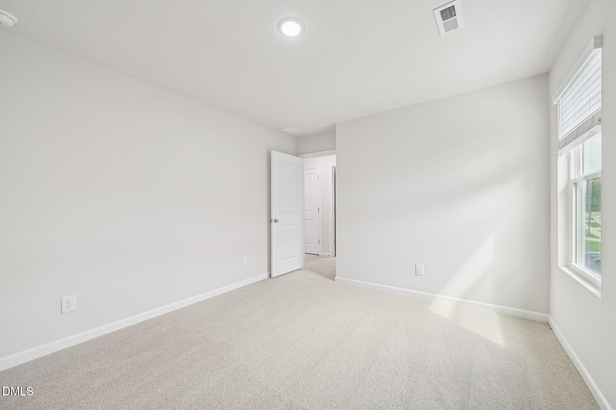 1454 Hatteras Road Durham, NC 27703 - Photo 51 of 53 an empty room with windows