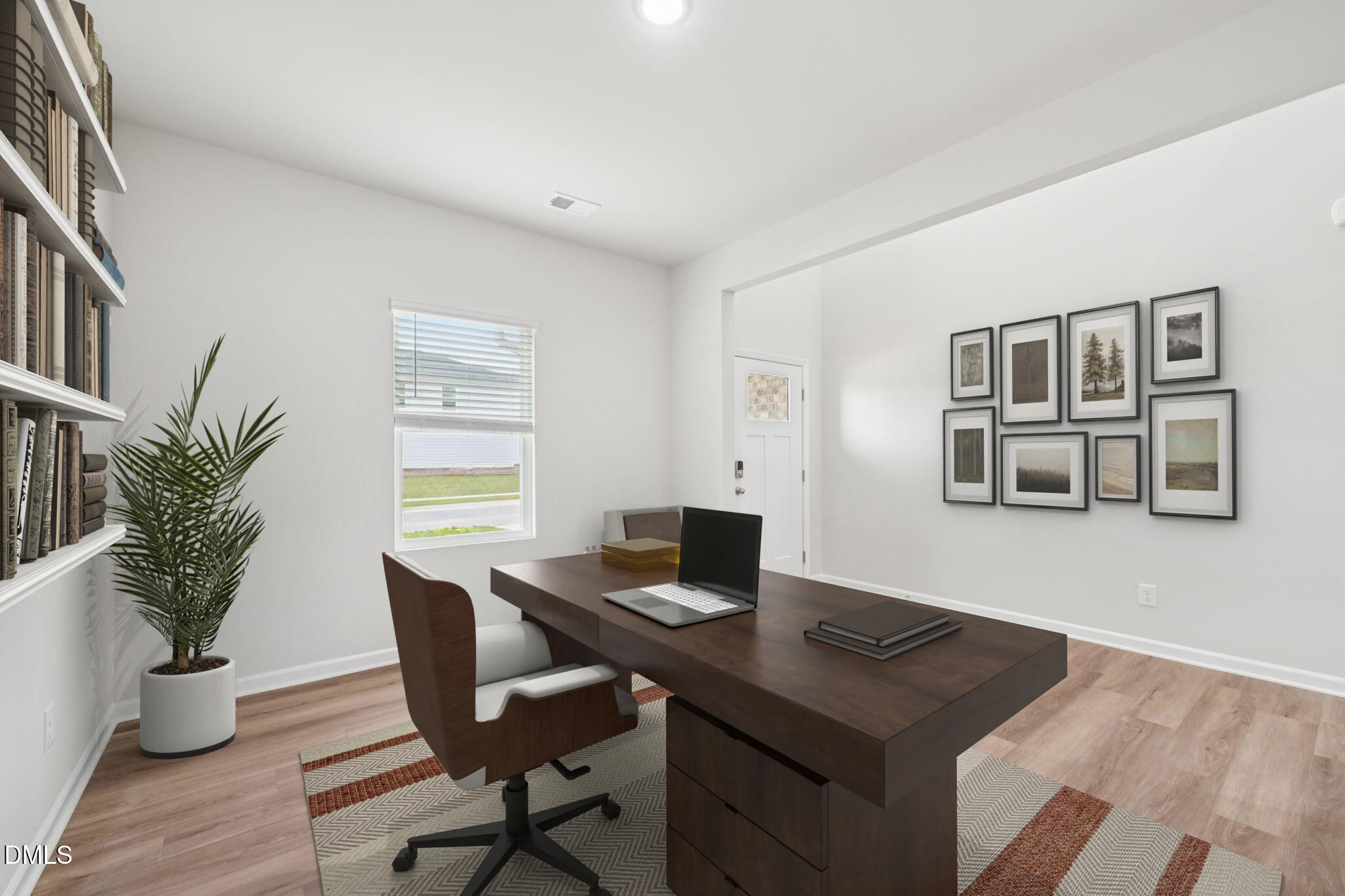 1454 Hatteras Road Durham, NC 27703 - Photo 6 of 53 a view of a workspace with furniture and wooden floor