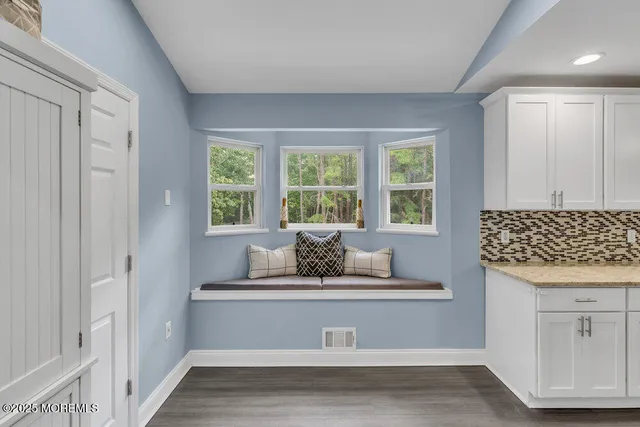 a living room with furniture and window