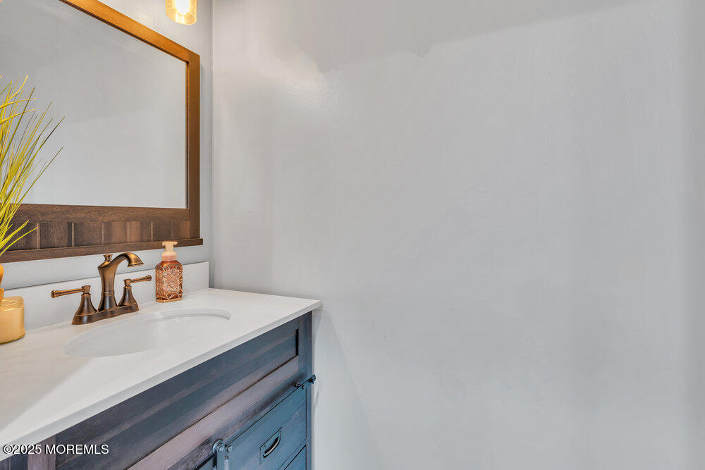 375 South Stump Tavern Road Jackson, NJ 08527 - Photo 14 of 34 a bathroom with a sink and a mirror