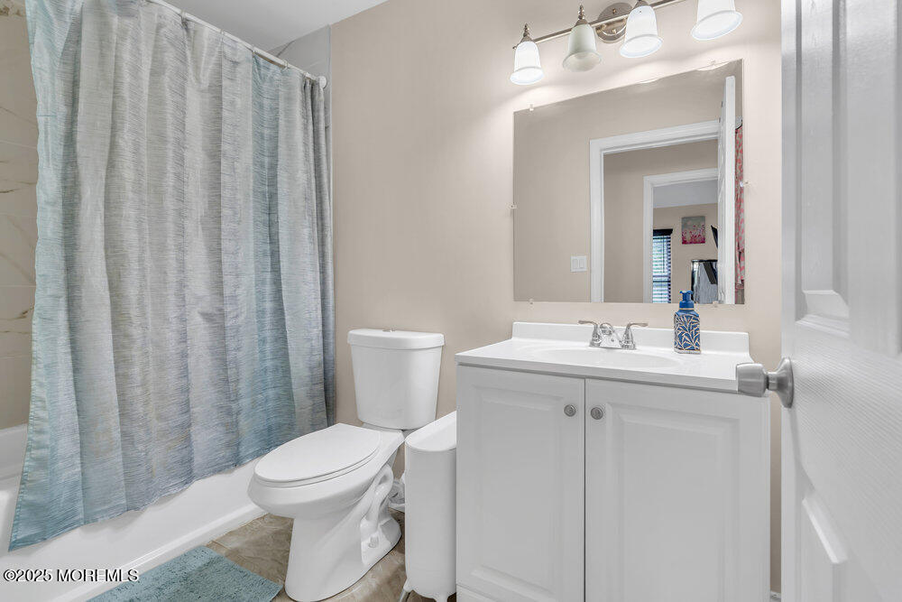 375 South Stump Tavern Road Jackson, NJ 08527 - Photo 16 of 34 a bathroom with a sink a toilet and shower curtain