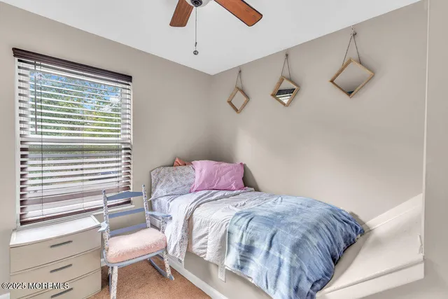 a bedroom with a bed and chair