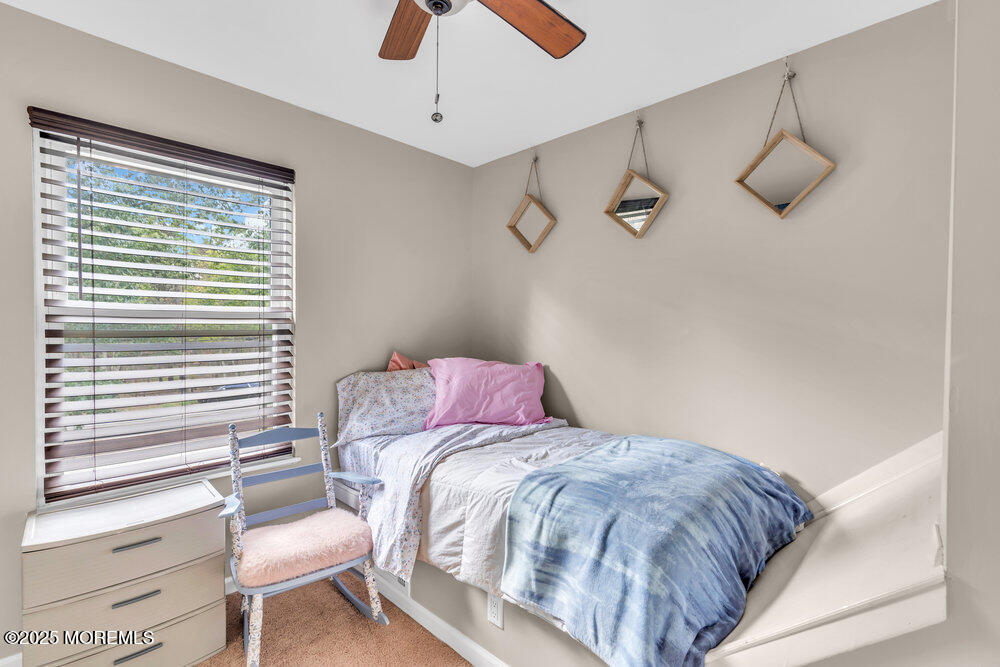 375 South Stump Tavern Road Jackson, NJ 08527 - Photo 17 of 34 a bedroom with a bed and chair