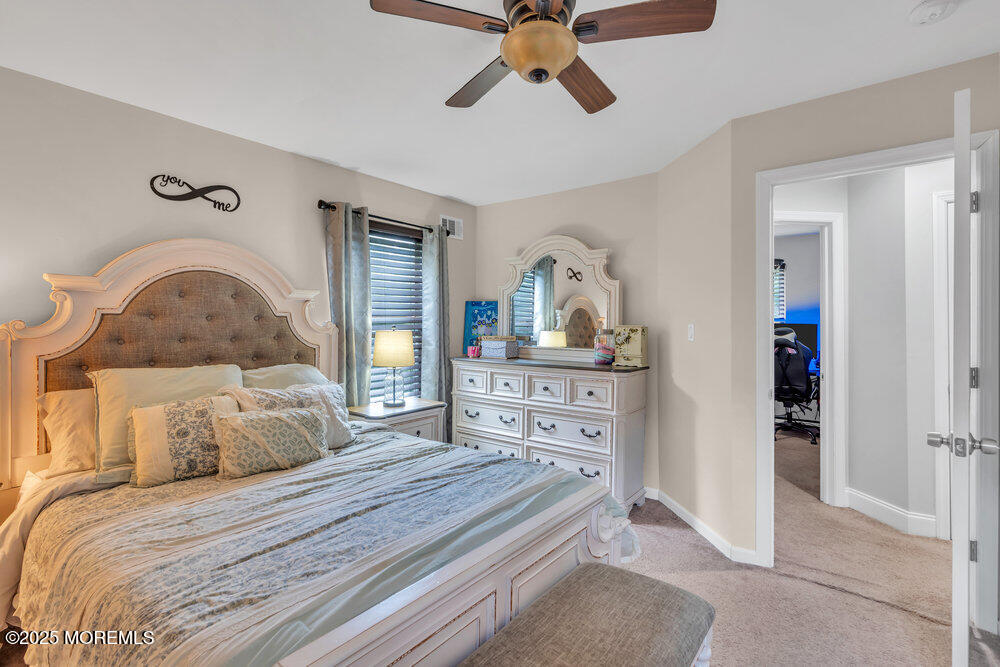 375 South Stump Tavern Road Jackson, NJ 08527 - Photo 19 of 34 a bedroom with a bed and ceiling fan