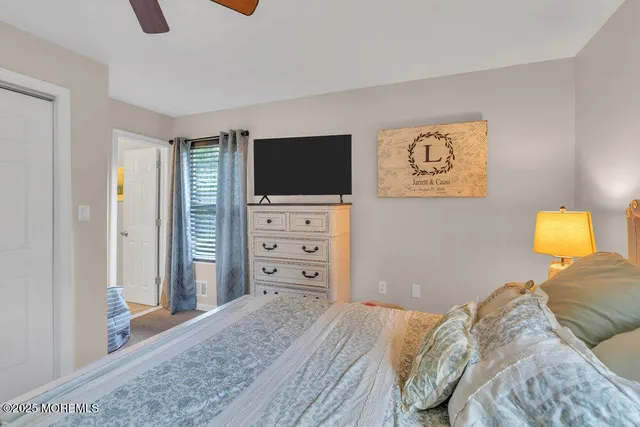 a bedroom with a bed and television