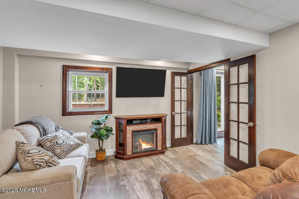 375 South Stump Tavern Road Jackson, NJ 08527 - Photo 27 of 34 a living room with furniture a window and a fireplace