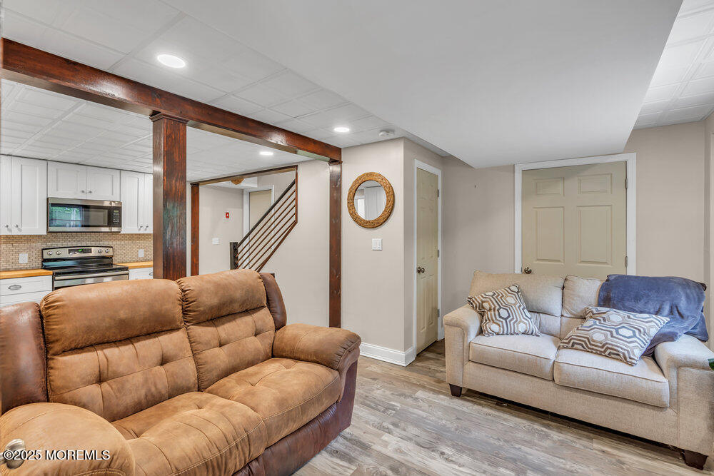 375 South Stump Tavern Road Jackson, NJ 08527 - Photo 28 of 34 a living room with furniture and a flat screen tv