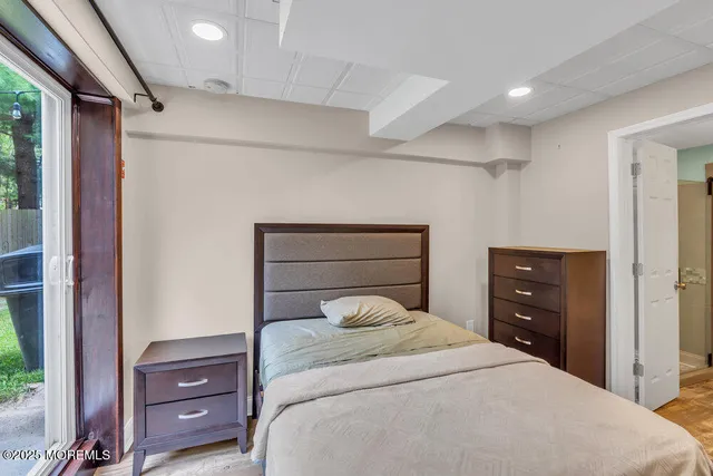 a bedroom with a bed and a dresser