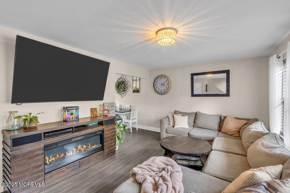 375 South Stump Tavern Road Jackson, NJ 08527 - Photo 3 of 34 a living room with furniture and a flat screen tv