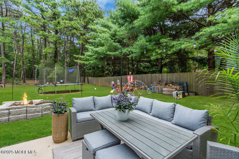 375 South Stump Tavern Road Jackson, NJ 08527 - Photo 31 of 34 a view of a patio with couches chairs and a yard