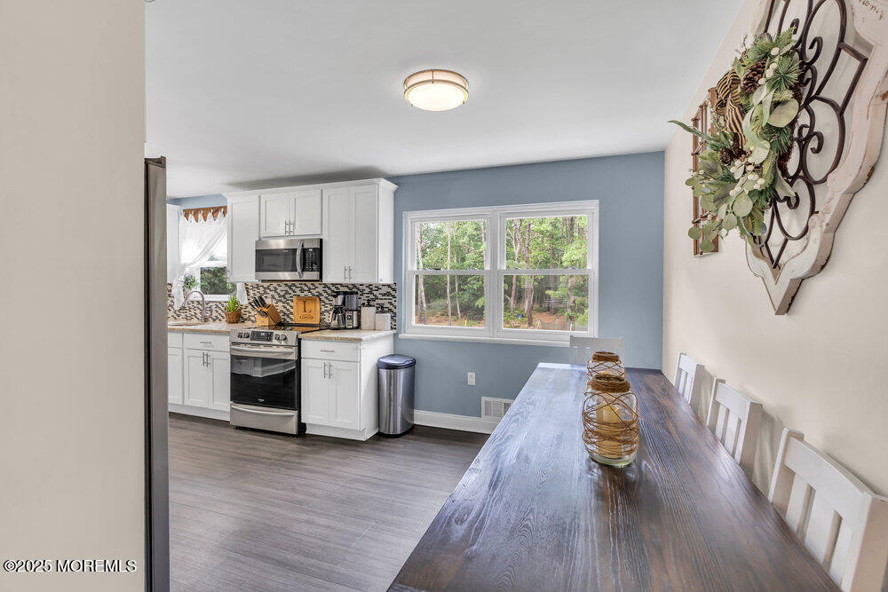 375 South Stump Tavern Road Jackson, NJ 08527 - Photo 6 of 34 a kitchen with a refrigerator and a stove top oven