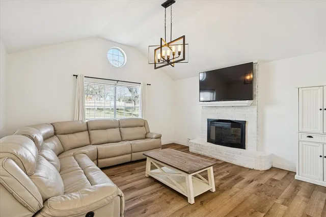 a view of entryway with livingroom and wooden floor