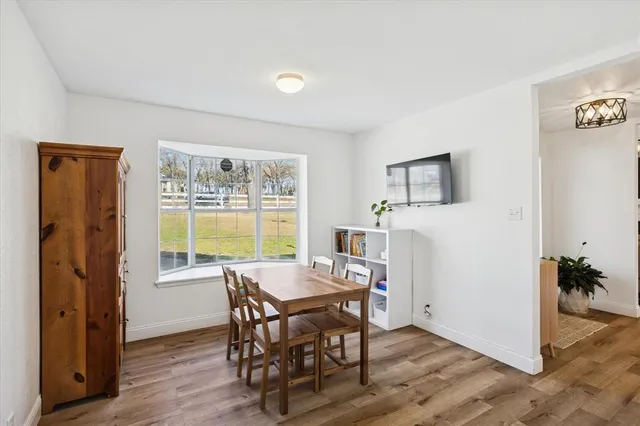 a living room with a fireplace and a fireplace