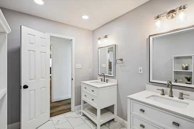 a bedroom with a bed couch and a window