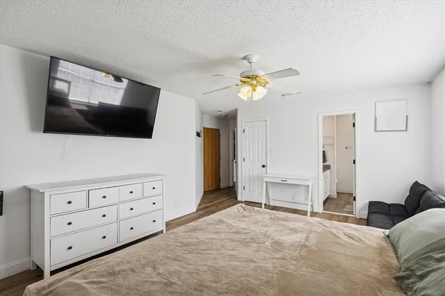a bedroom with furniture and a window