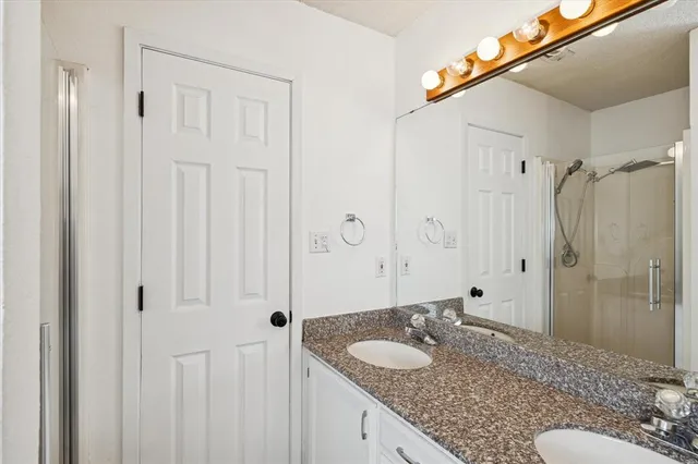 a view of storage and utility room with washer and dryer