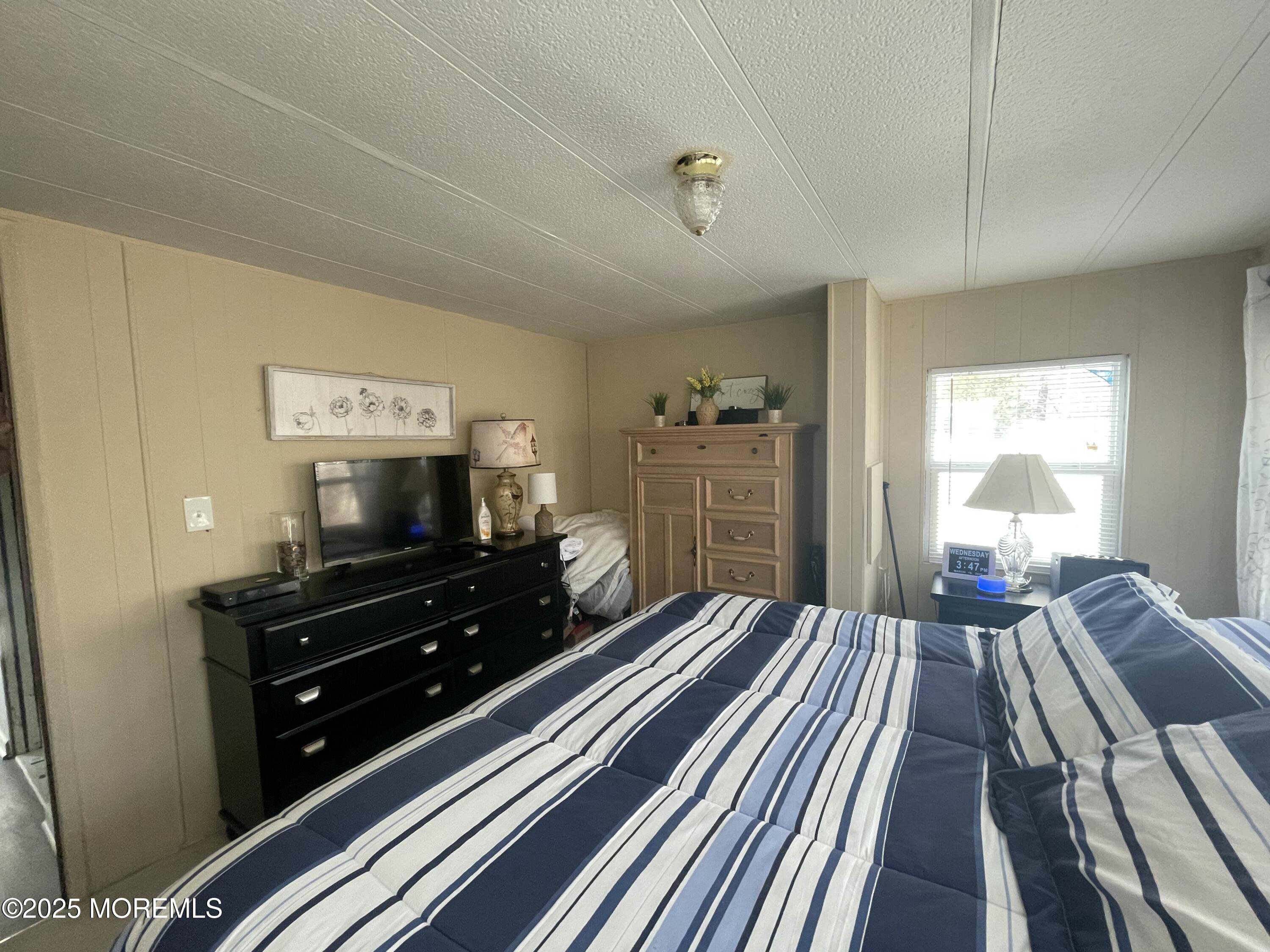 54 Alissa Terrace Jackson, NJ 08527 - Photo 11 of 13 a living room with furniture and a flat screen tv