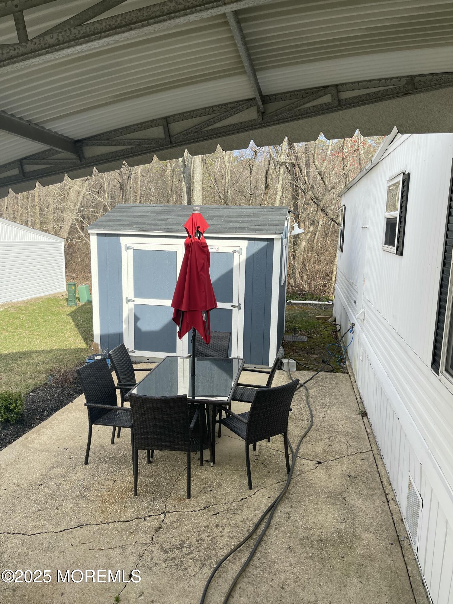 54 Alissa Terrace Jackson, NJ 08527 - Photo 13 of 13 a view of a chairs and table in the balcony