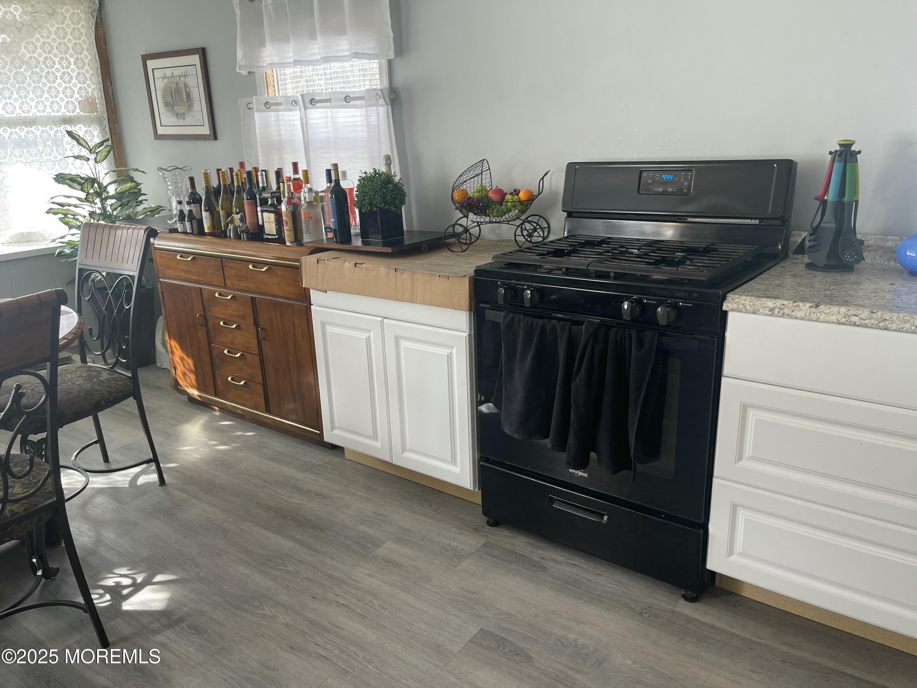 54 Alissa Terrace Jackson, NJ 08527 - Photo 7 of 13 a kitchen with a stove and cabinets