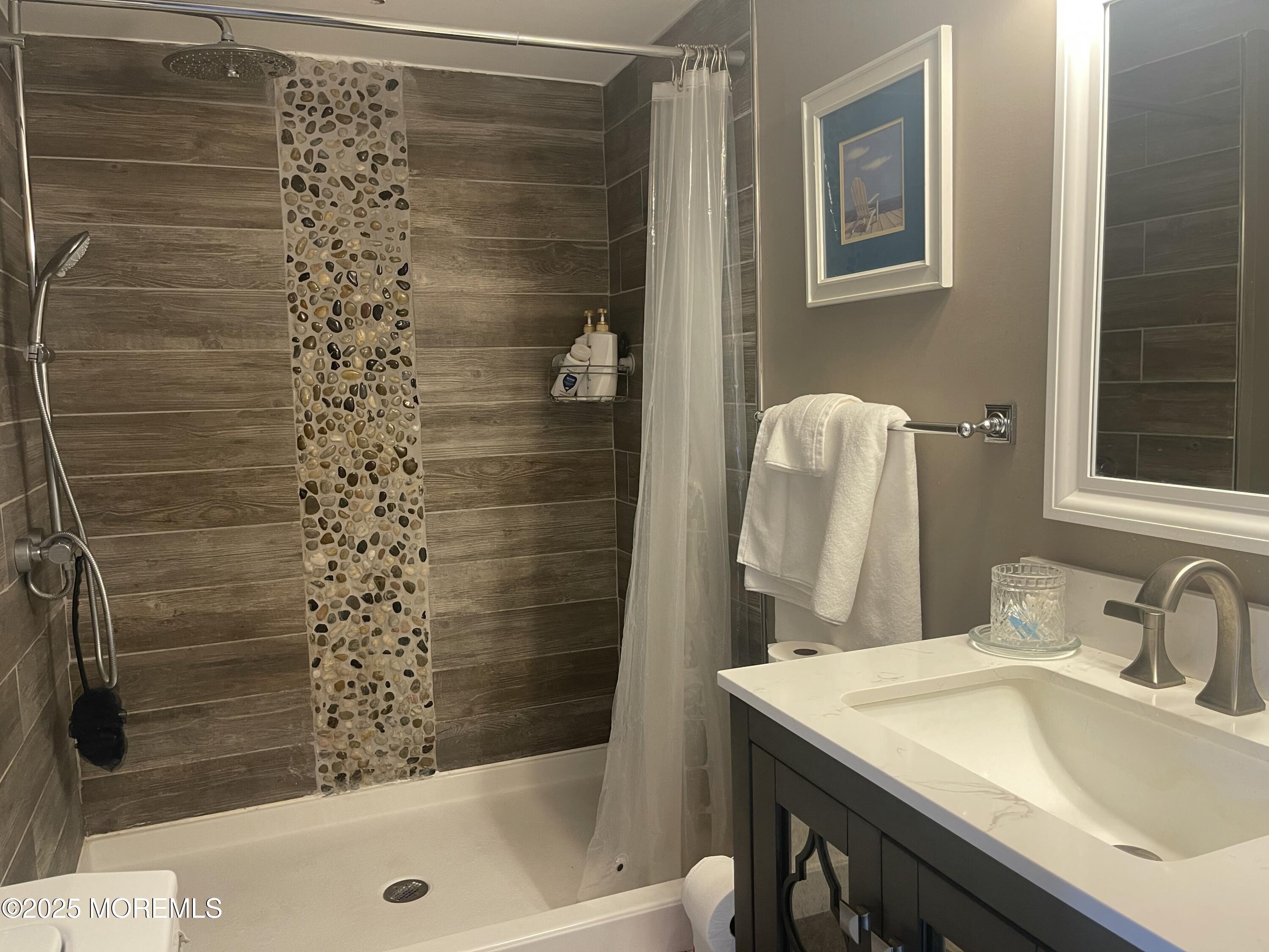 54 Alissa Terrace Jackson, NJ 08527 - Photo 8 of 13 a bathroom with a sink and a shower