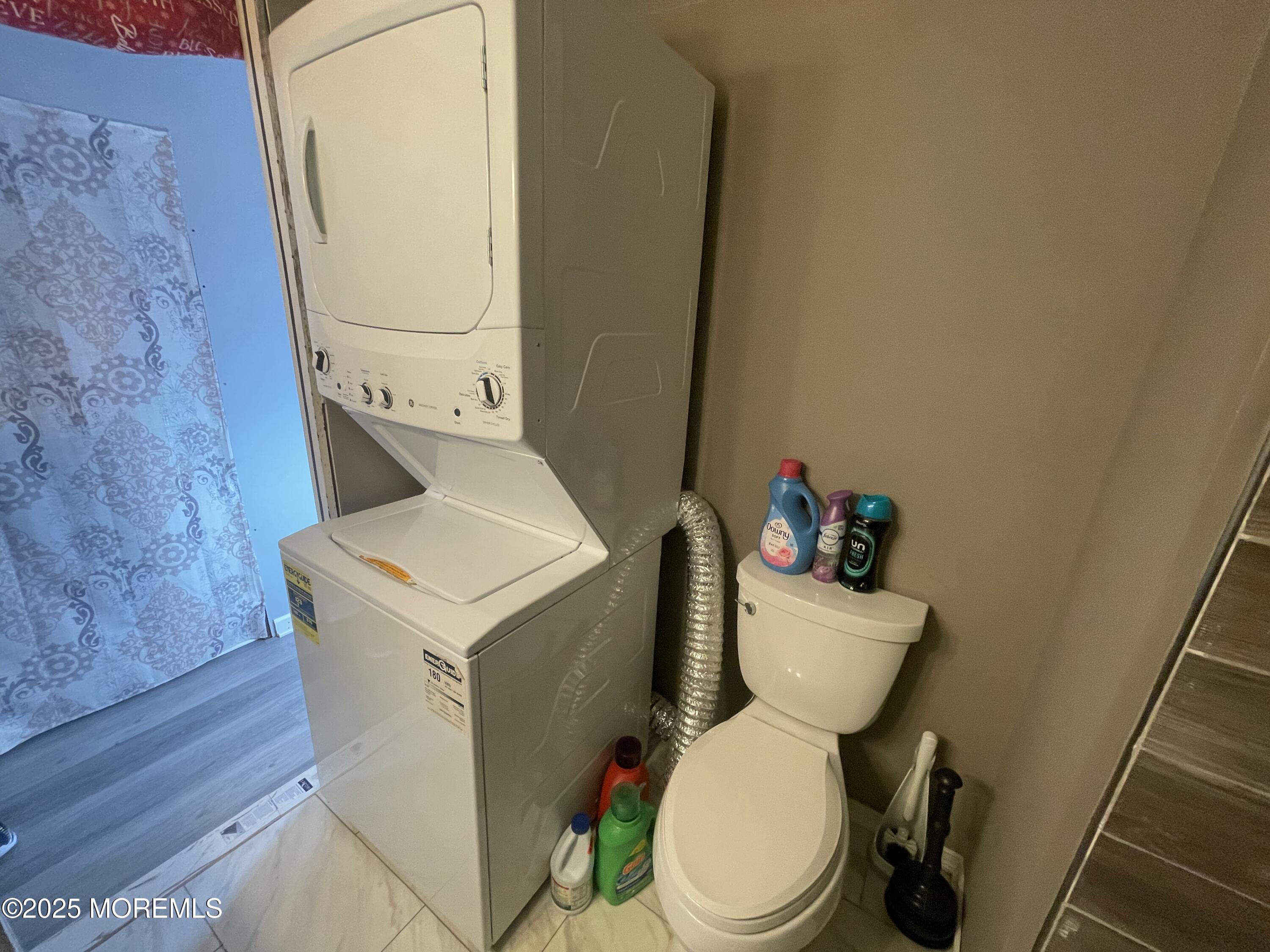 54 Alissa Terrace Jackson, NJ 08527 - Photo 9 of 13 a white toilet sitting next to a sink