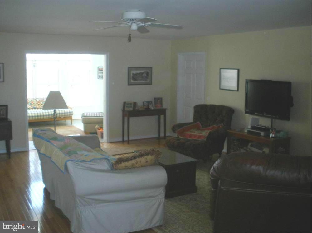 Great room is open to gourmet kitchen and sunroom