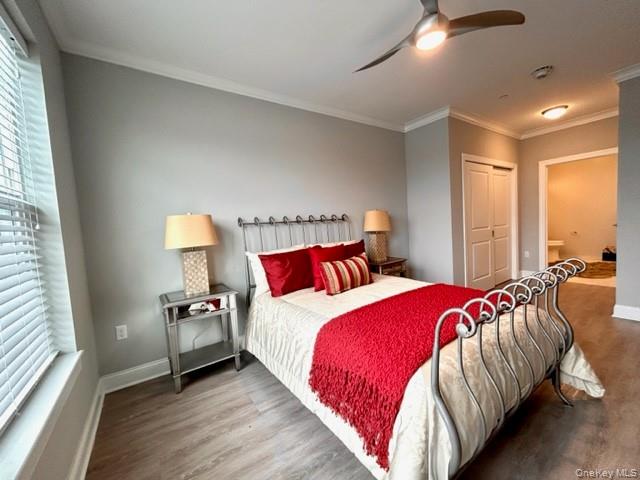 75 East Hoffman Avenue, Unit 2077 Lindenhurst, NY 11757 - Photo 11 of 15 a bedroom with bed and a large window