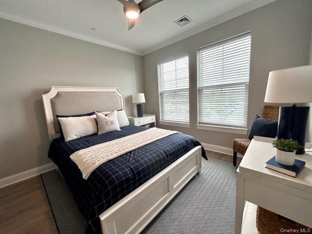 75 East Hoffman Avenue, Unit 2077 Lindenhurst, NY 11757 - Photo 12 of 15 a bed room with a bed tv and a window