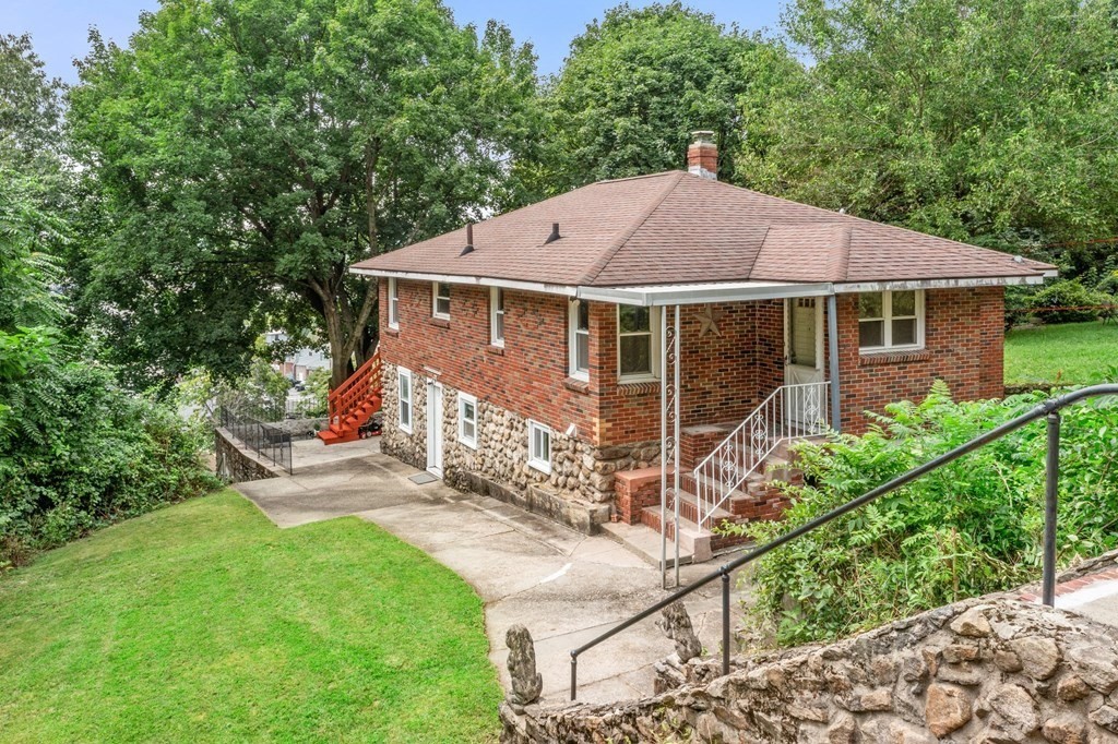 3 Wilson Street Worcester, MA 01604 - Photo 1 of 42 a view of a house with a yard and potted plants