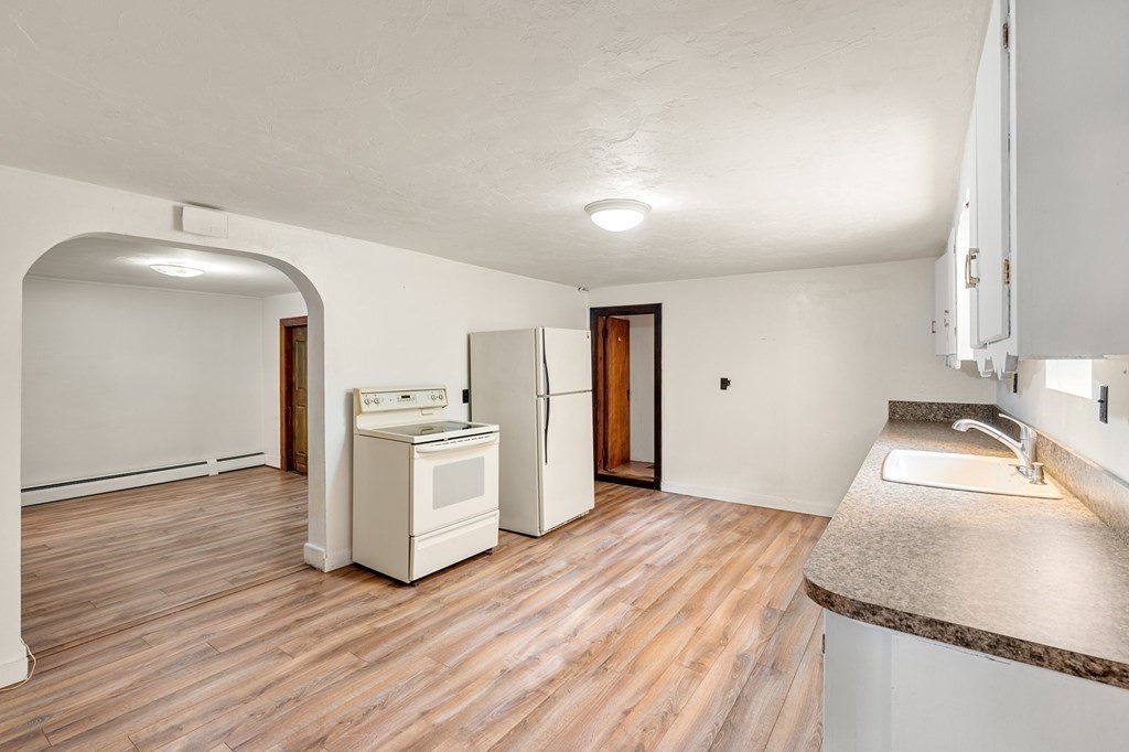 3 Wilson Street Worcester, MA 01604 - Photo 25 of 42 a kitchen with a sink and a stove top oven