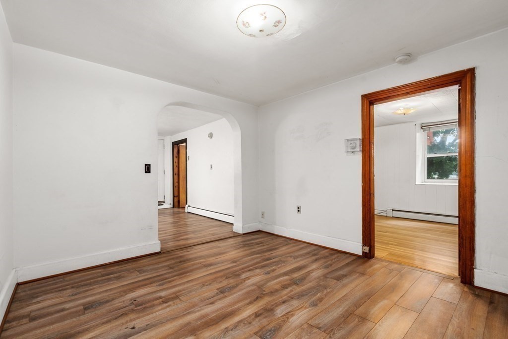 3 Wilson Street Worcester, MA 01604 - Photo 31 of 42 an empty room with wooden floor and windows