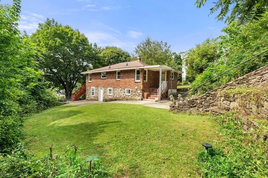 3 Wilson Street Worcester, MA 01604 - Photo 35 of 42 a front view of a house with garden