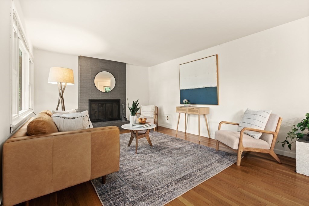 3 Wilson Street Worcester, MA 01604 - Photo 7 of 42 a living room with furniture a flat screen tv and a fireplace